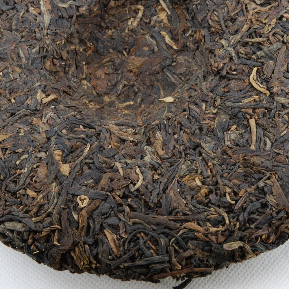 Pu-Erh Tea Cake, Yuenhai Yiwu Mountain Wild Arbor Tea , Year 2003 (Raw/Sheng)