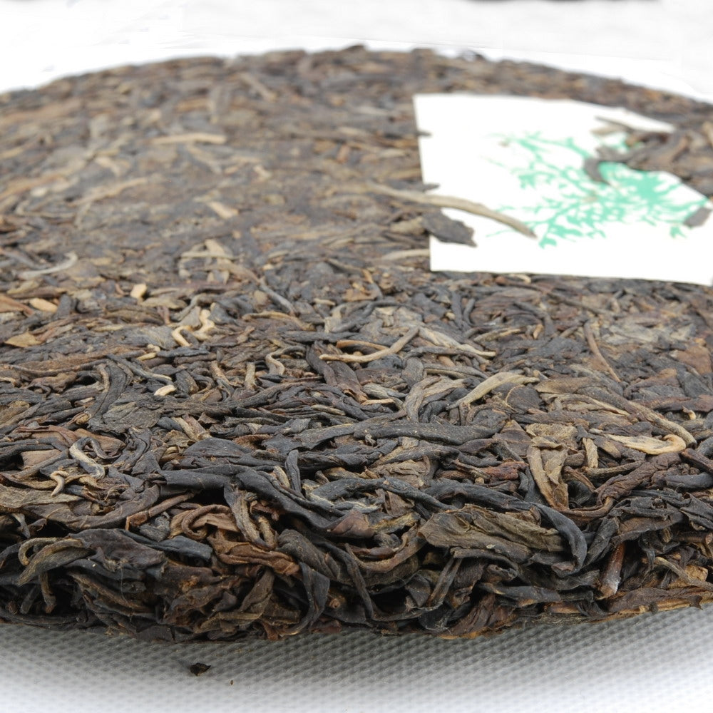 Pu-Erh Tea Cake, Yuenhai Yiwu Mountain Wild Arbor Tea , Year 2003 (Raw/Sheng)